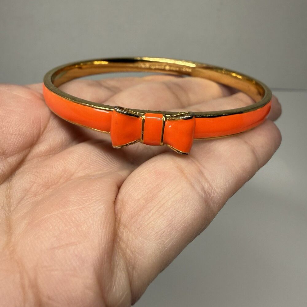 Kate Spade New York Skinny Gold And Orange Enamel Bangle Bow Bracelet - Picture 2 of 8